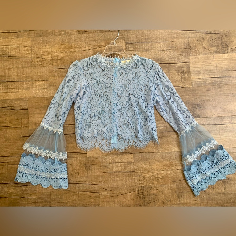 Lace crop top with intricate flared lace sleeves